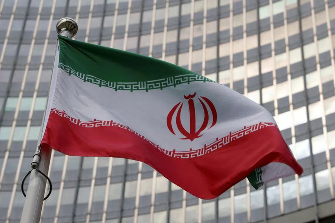 FILE PHOTO: The Iranian flag flutters in front of the International Atomic Energy Agency (IAEA) organisation's headquarters in Vienna, Austria, June 5, 2023. REUTERS/Leonhard Foeger/File Photo