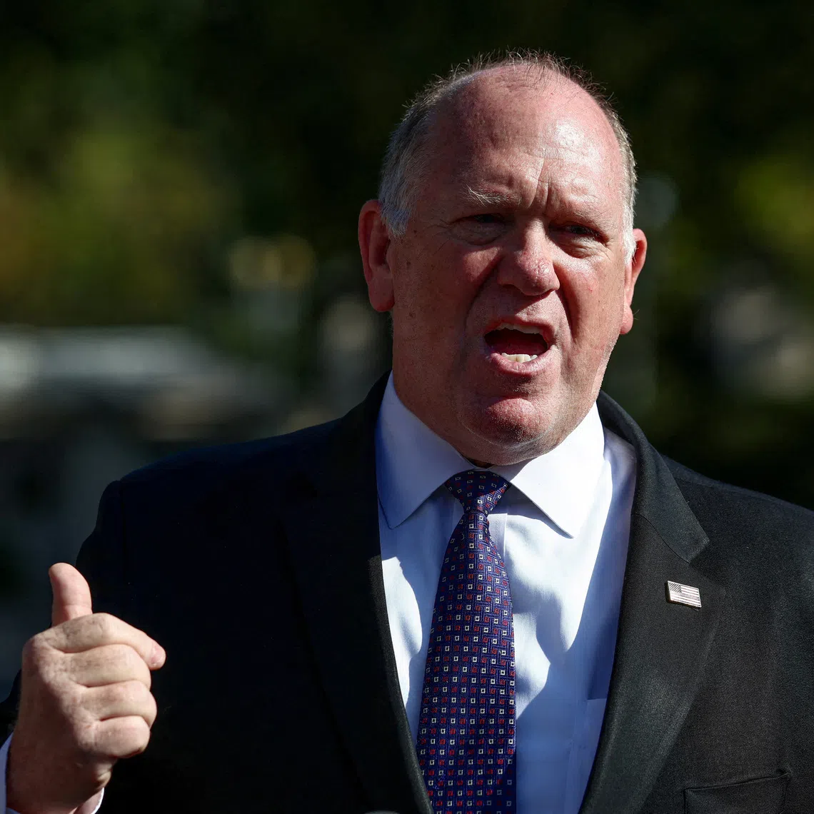 FILE PHOTO: Tom Homan, U.S. President Donald Trump’s border czar, speaks to the media outside the White House in Washington, U.S., September 9, 2025. REUTERS/Evelyn Hockstein/File Photo