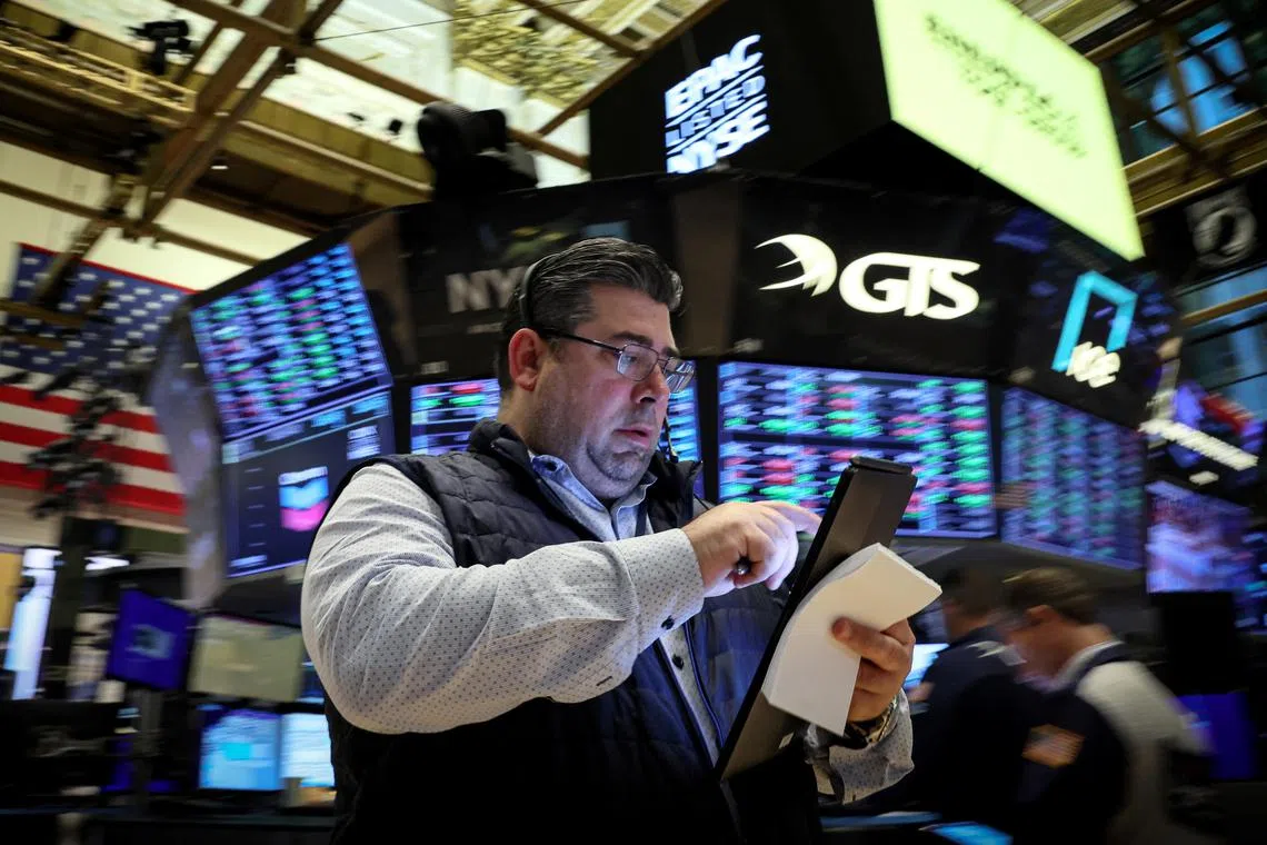 Traders work on the floor of the New York Stock Exchange, in New York City.