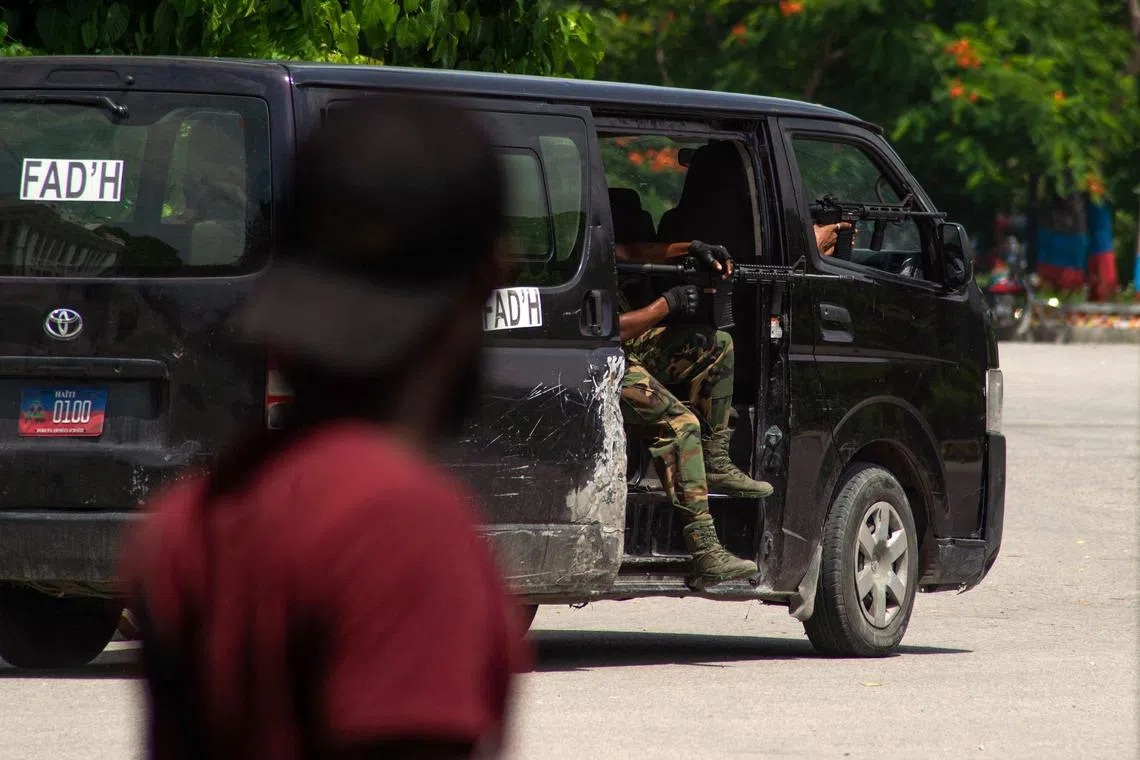 Armed members of the military patrol an area where armed gangs have been active in Port-au-Prince, Haiti's capital, in June 2024.