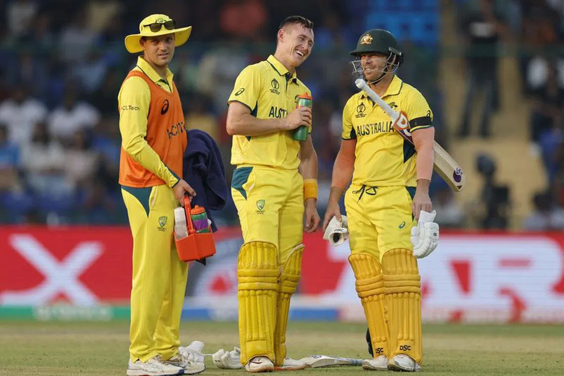 FILE PHOTO: Cricket - ICC Cricket World Cup 2023 - Australia v Netherlands - Arun Jaitley Stadium, New Delhi, India - October 25, 2023 Australia's Marnus Labuschagne and David Warner during the match REUTERS/Adnan Abidi/file Photo