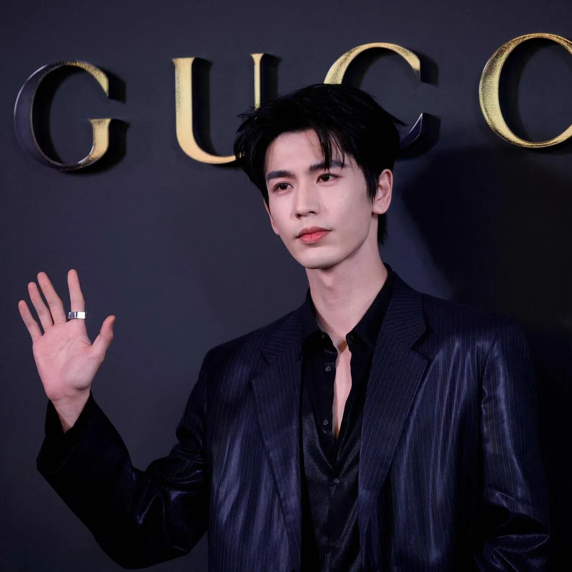 Chinese actor Zhang Linghe attends the Gucci Cruise 2027 collection fashion show at Times Square in New York on May 16, 2026. 