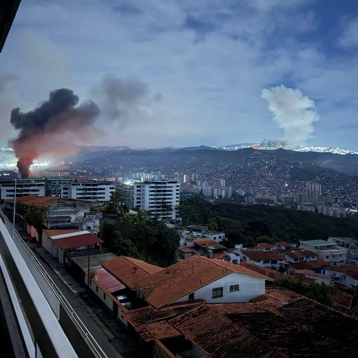 A screengrab footage shows smoke billowing over Caracas after a series of explosions on Jan 3.