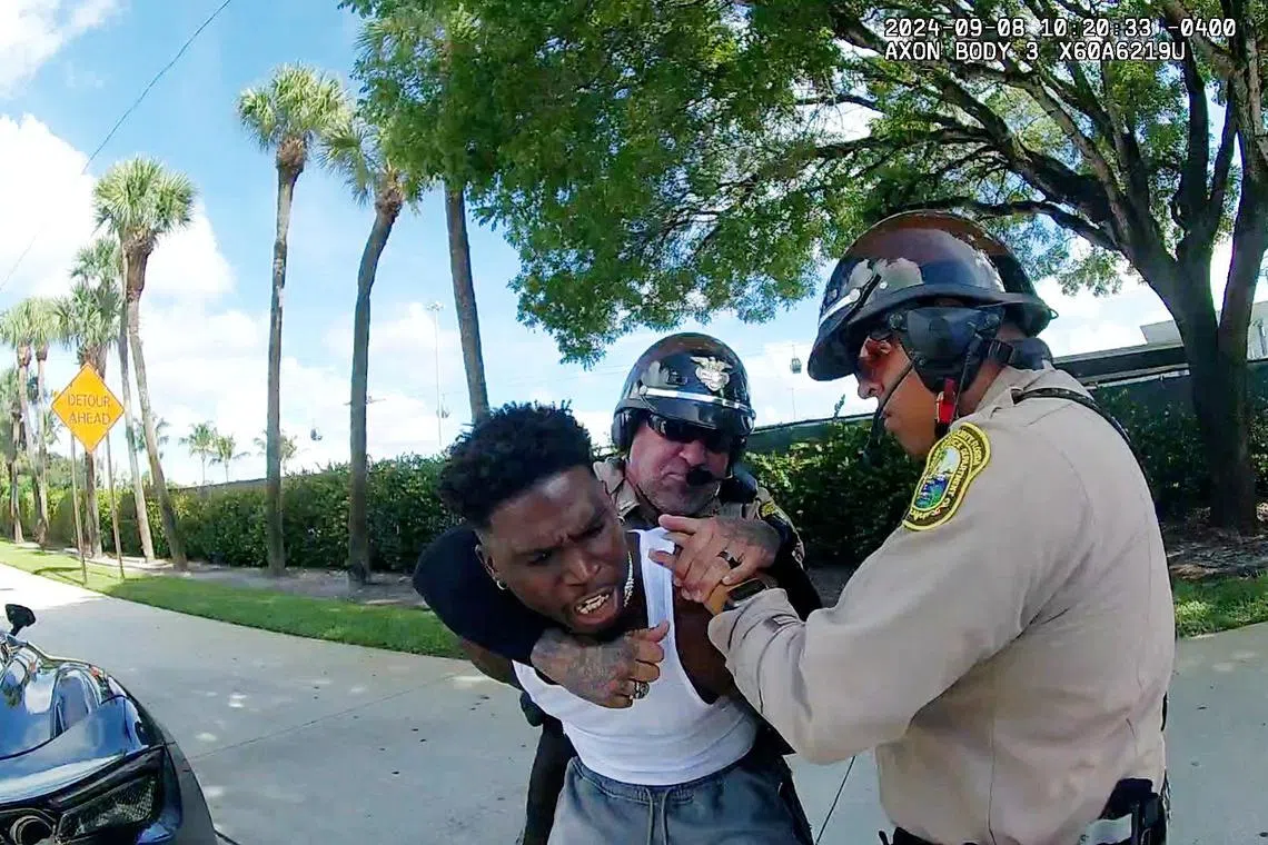 Miami Dolphins receiver Tyreek Hill is forced to the ground after being handcuffed by Miami-Dade Police Department officers in Miami, Florida, September 8, 2024 in a still image from police body camera video.  Miami-Dade Police Department/Handout via REUTERS.
THIS IMAGE HAS BEEN SUPPLIED BY A THIRD PARTY