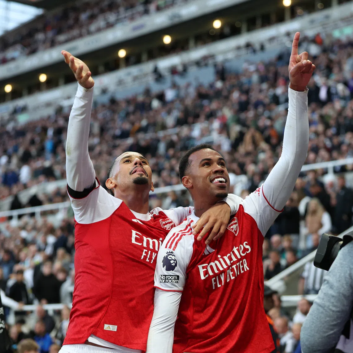 Soccer Football - Premier League - Newcastle United v Arsenal - St James' Park, Newcastle, Britain - September 28, 2025 Arsenal's Gabriel Magalhaes celebrates scoring their second goal with William Saliba REUTERS/Scott Heppell
