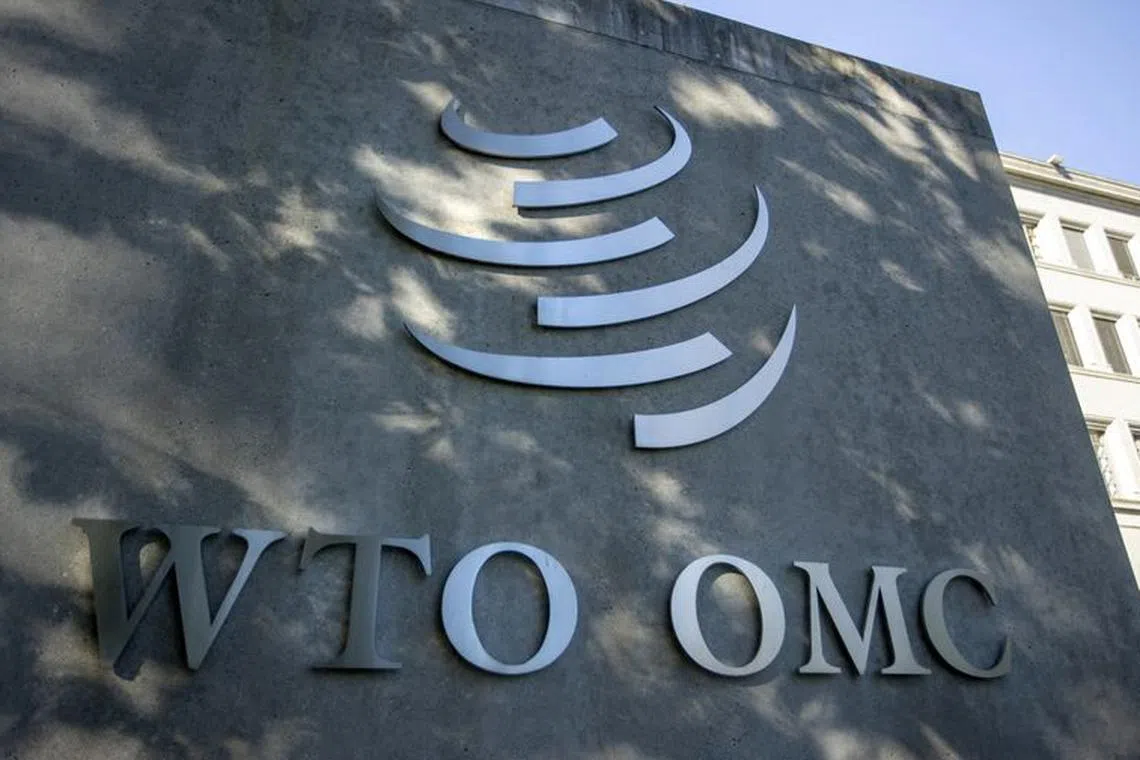 FILE PHOTO: A logo is seen at the World Trade Organization (WTO) headquarters before a news conference in Geneva, Switzerland, October 5, 2022. REUTERS/Denis Balibouse/File Photo