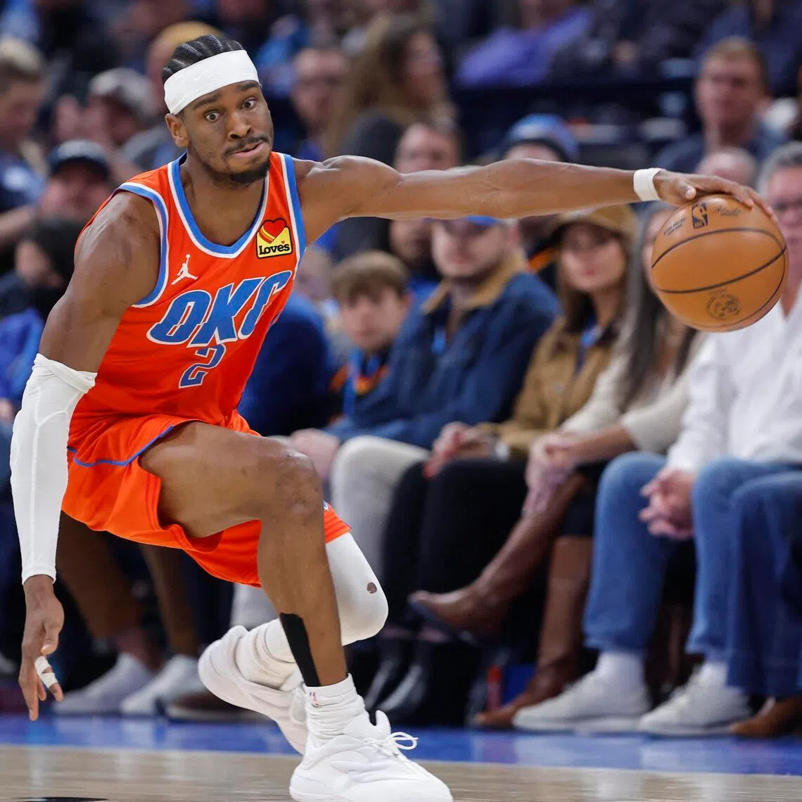 Oklahoma City Thunder guard Shai Gilgeous-Alexander reaches for a loose ball during the second half against the Toronto Raptors at Paycom Center. 