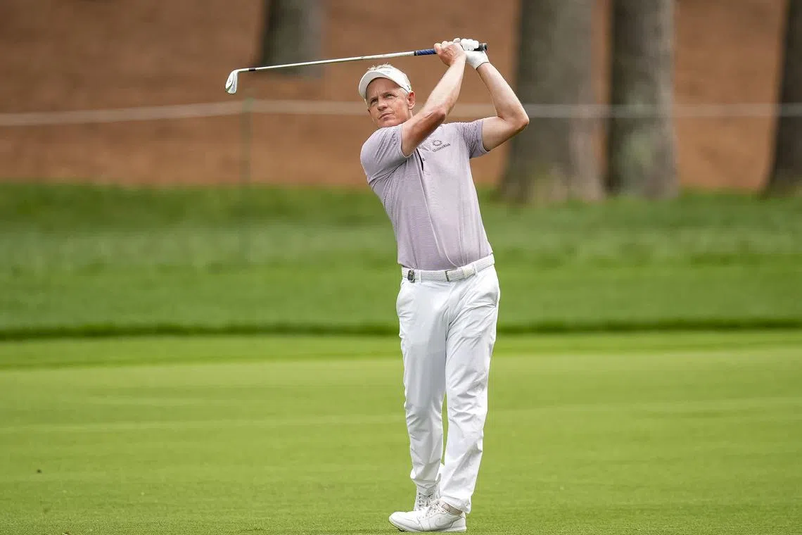 FILE PHOTO: May 16, 2025; Charlotte, North Carolina, USA; Luke Donald hits his second shot on the second hole during the second round of the PGA Championship golf tournament at Quail Hollow. Mandatory Credit: Jim Dedmon-Imagn Images/File Photo