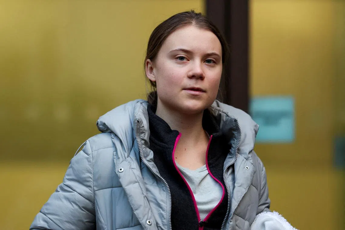 FILE PHOTO: Climate activist Greta Thunberg looks on outside Westminster Magistrates' Court, after she was cleared of a public order offence over a protest outside an oil and gas conference last year, in London, Britain, February 2, 2024. REUTERS/Isabel Infantes/File Photo