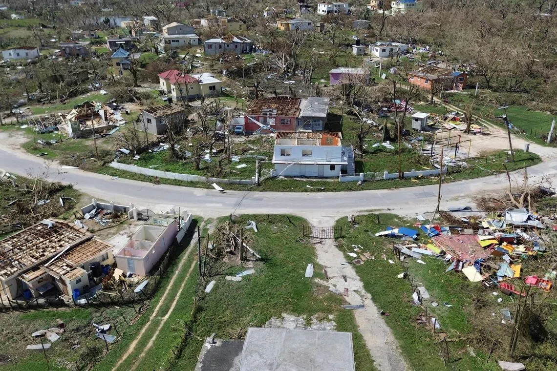 An aerial view shows damaged buildings in the aftermath of Hurricane Melissa in Lewis Town, St Elizabeth, Jamaica, on Oct 31, 2025. 