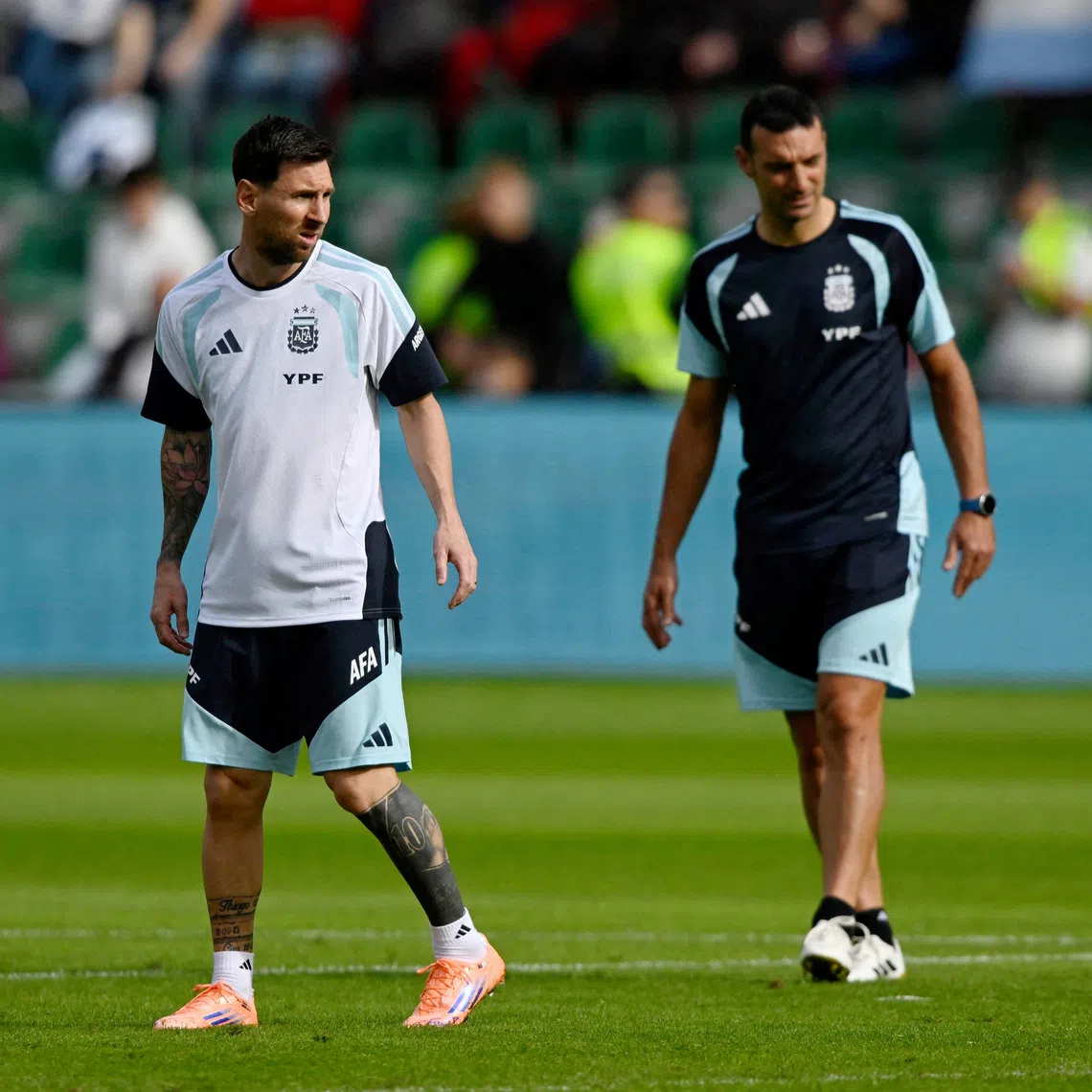 FILE PHOTO: File Photo: Soccer Football - International Friendly - Argentina Training - Estadio Manuel Martinez Valero, Elche, Spain - November 13, 2025 Argentina's Lionel Messi with coach Lionel Scaloni during training REUTERS/Pablo Morano/File Photo/File Photo
