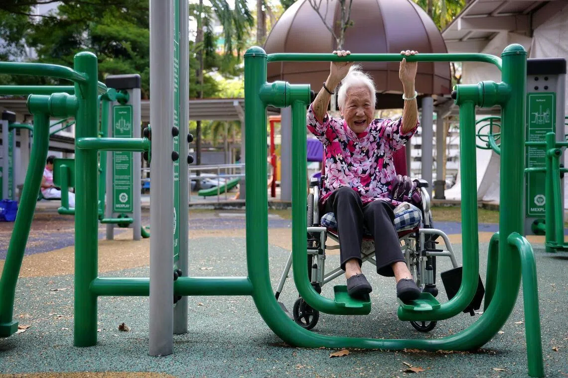 Madam Lee Yim Leng, 105, exercising her legs at a fitness corner near NTUC Health Active Ageing Centre (Care) (Wisma Geylang Serai) in Haig Road on Jan 26.
