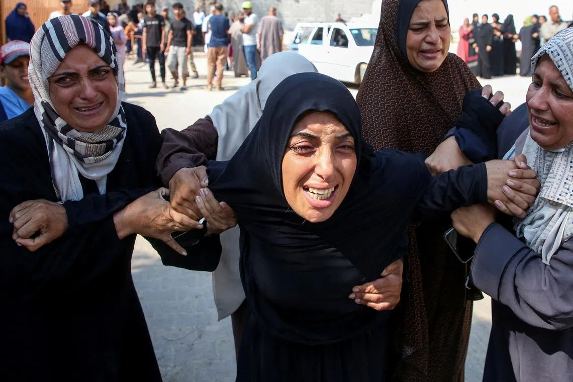 FILE PHOTO: The mother of Kamel Ghabayen, a Palestinian who was detained by Israel and is said to have been killed in an Israeli strike upon his release, reacts at Nasser hospital, amid the Israel-Hamas conflict, in Khan Younis in the southern Gaza Strip July 7, 2024. REUTERS/Hatem Khaled/File Photo