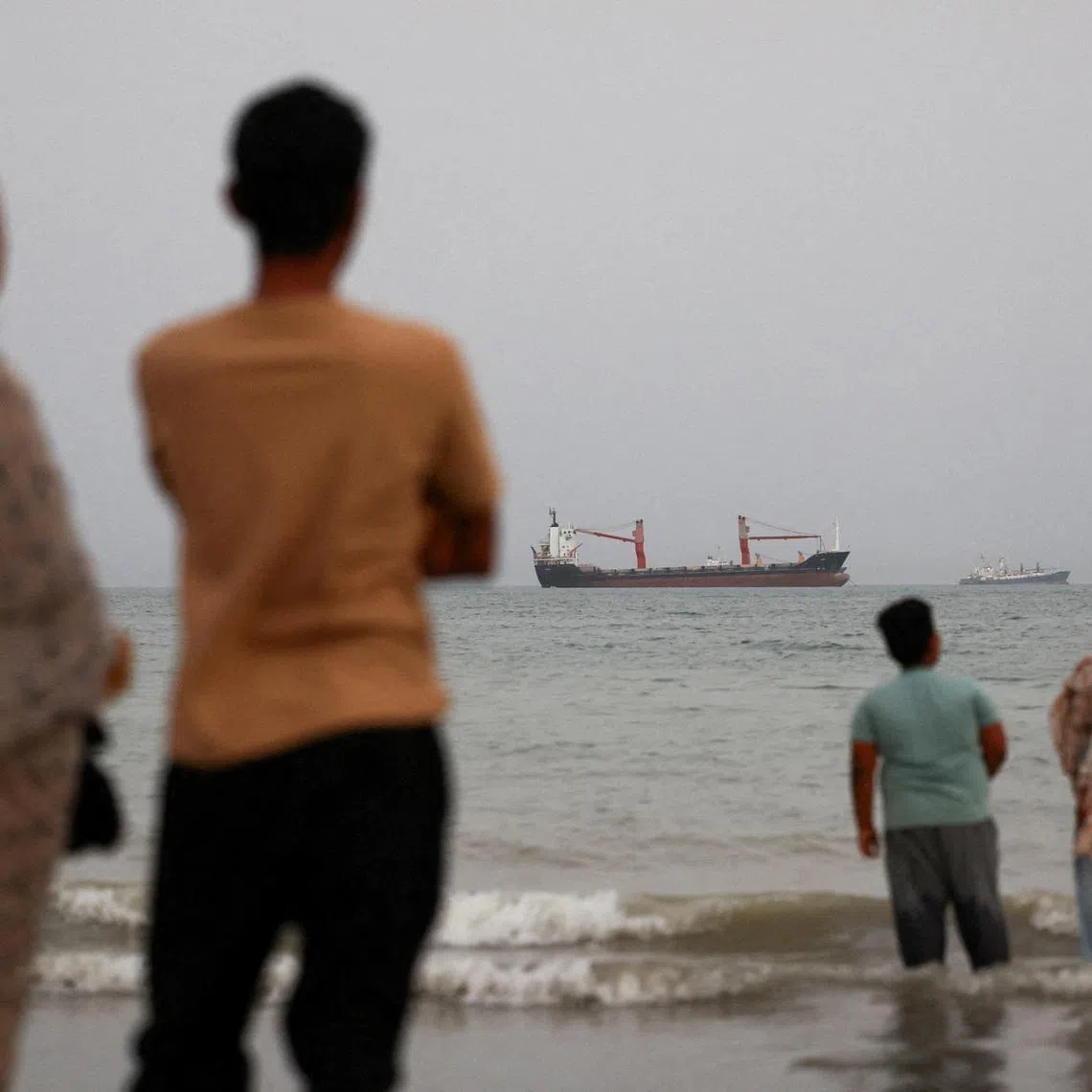 Vessels in the Strait of Hormuz are visible near the beach of Bandar Abbas, Iran. Southern Iran, which borders the Strait of Hormuz, has been a major target of US attacks on infrastructure.