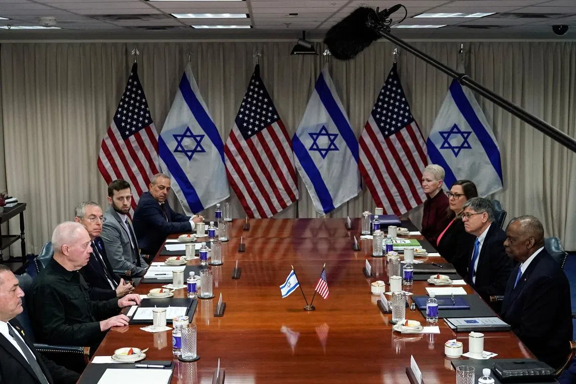 US Defense Secretary Lloyd Austin (right) meets Israeli Defense Minister Yoav Gallant (second from left) at the Pentagon on March 26.