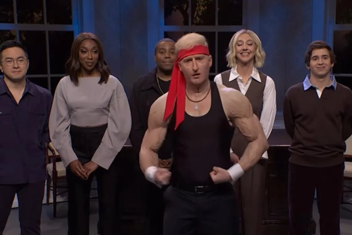 James Austin Johnson (centre) appeared as “hot, jacked Trump” in the SNL opening sketch on Nov 9.