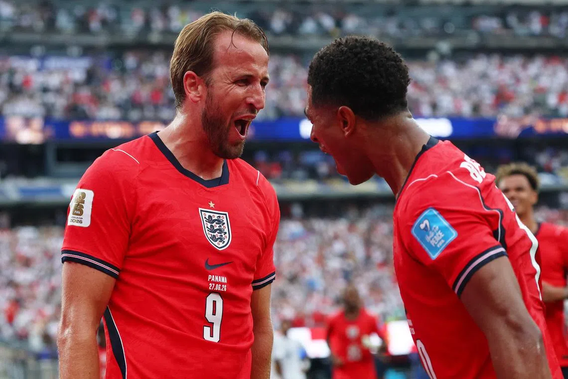 England’s Harry Kane celebrates scoring their second goal with Jude Bellingham, who provided the assist.
