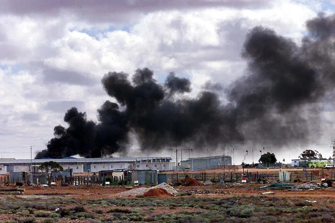Australia agrees to pay millions to compensate asylum seekers locked in desert