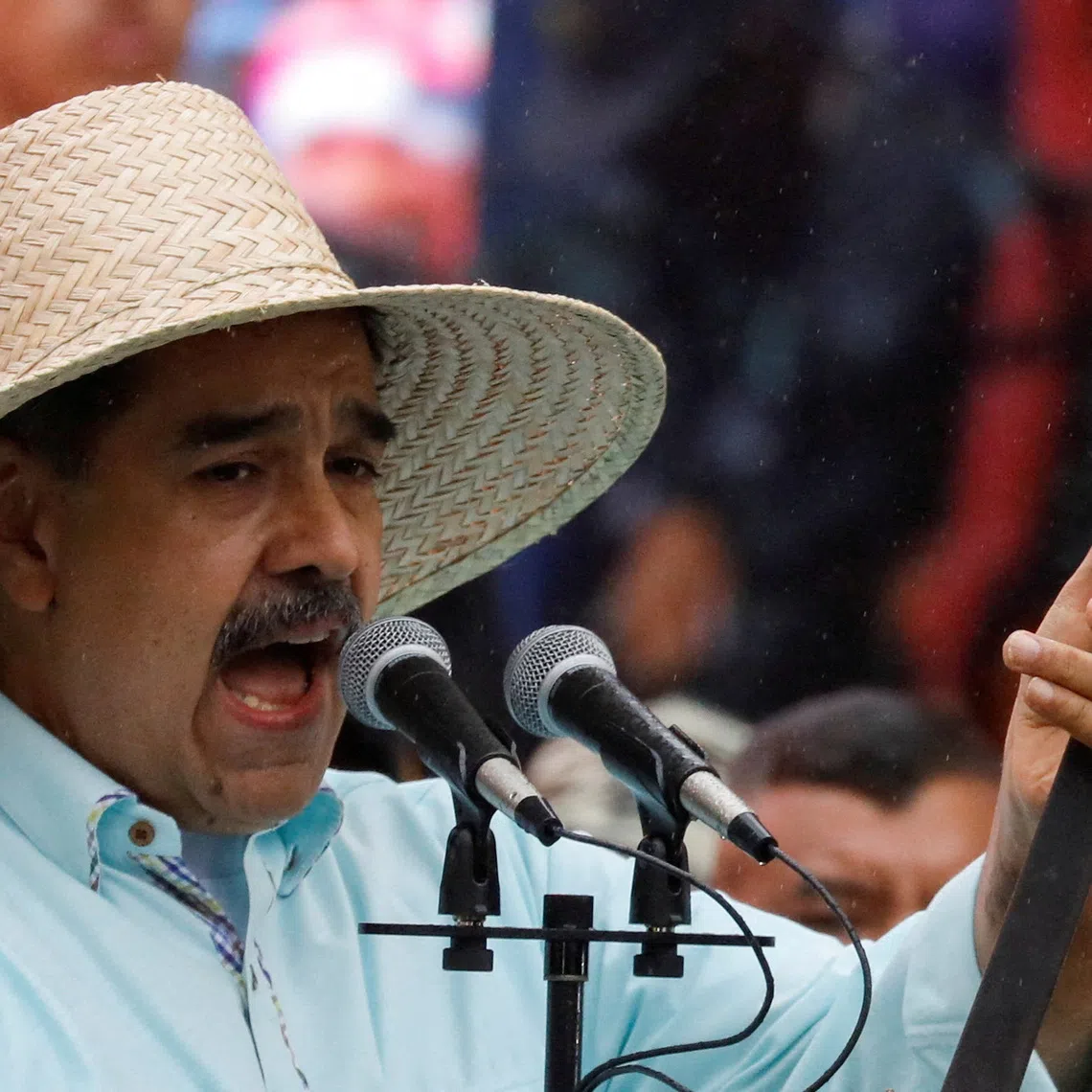FILE PHOTO: Venezuela's President Nicolas Maduro holds a sword which belonged to Ezequiel Zamora, a Venezuelan soldier and leader of the Federalists in the Federal War, as he addresses his supporters during a march to commemorate the Battle of Santa Ines, on the same day Venezuelan opposition leader Maria Corina Machado was awarded the 2025 Nobel Peace Prize in Norway, in Caracas, Venezuela, December 10, 2025. REUTERS/Leonardo Fernandez Viloria/File Photo/File Photo