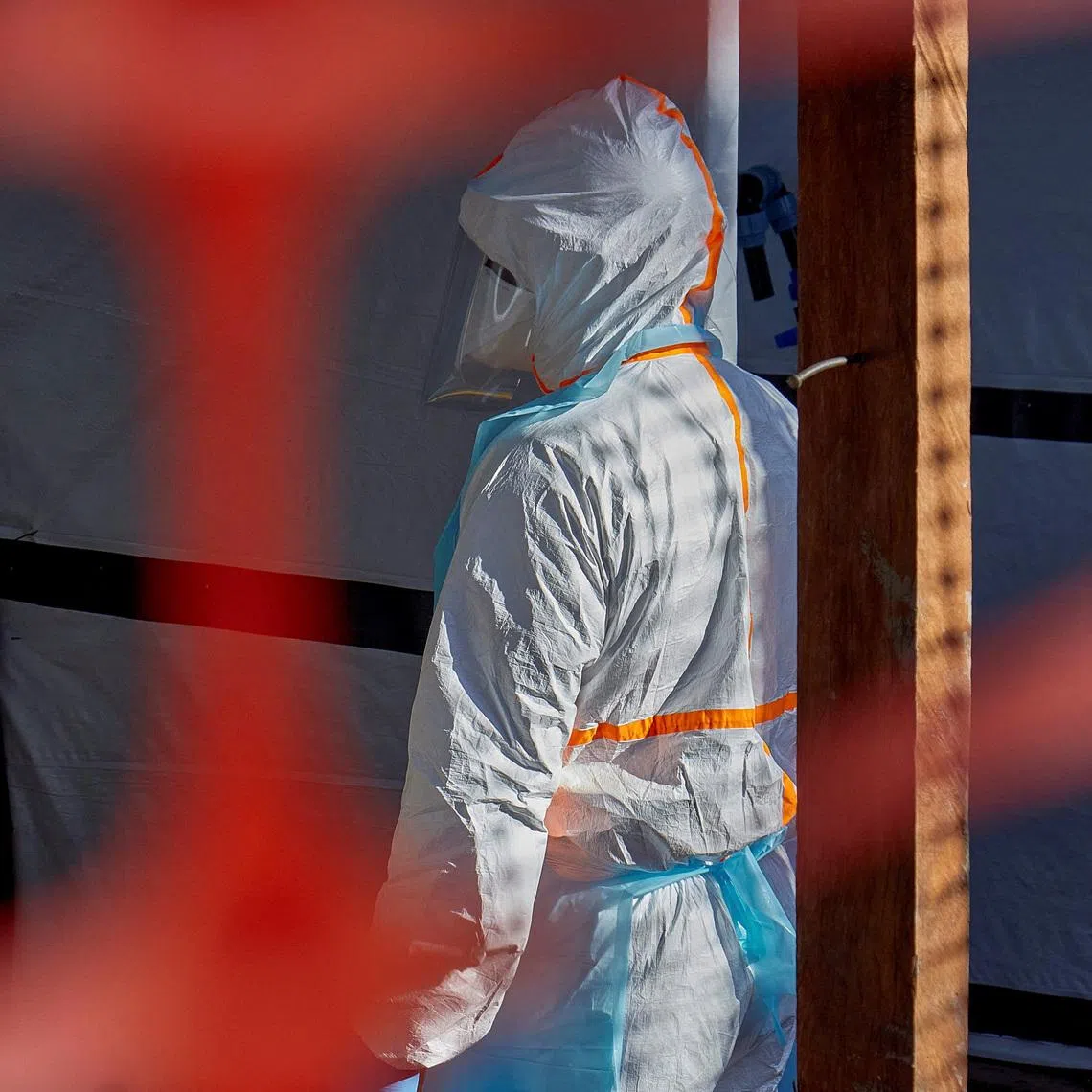 A health worker is dressed up in personal protective equipment (PPE) at the Evangelical Medical Center, one of the facilities at the forefront of the response to the Ebola outbreak, as agencies intensify efforts to contain a new Ebola outbreak caused by the Bundibugyo virus strain, in Bunia, Ituri province, Democratic Republic of Congo, May 31, 2026. REUTERS/Gradel Muyisa Mumbere