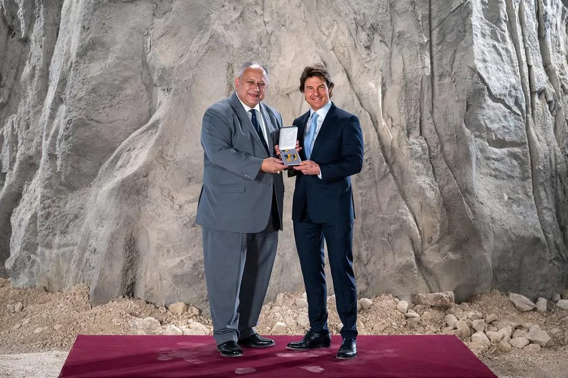 Hollywood actor Tom Cruise (right) with the United States Secretary of the Navy Carlos Del Toro (left). Cruise was awarded the Department of the Navy Distinguished Public Service Award, the highest honour the US Navy can bestow upon a civilian.