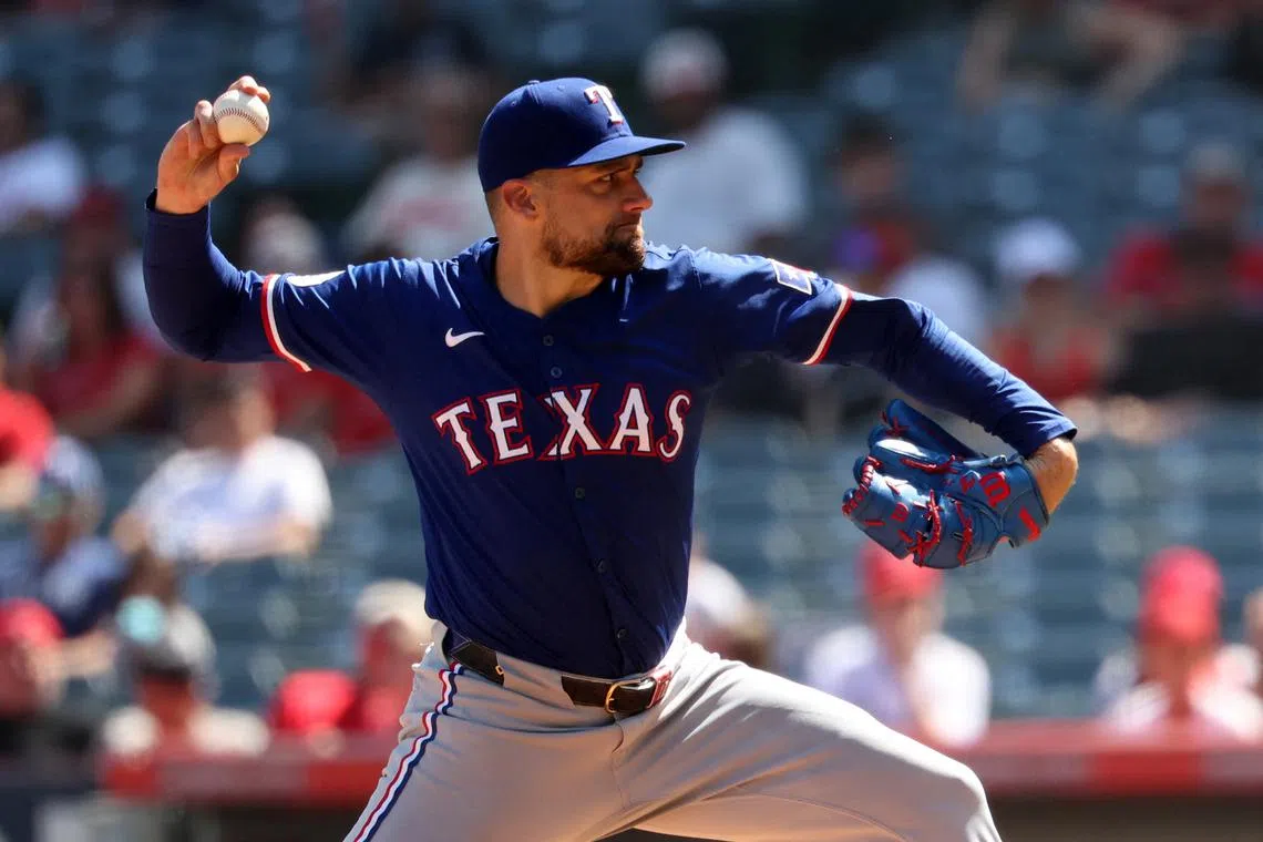 FILE PHOTO: Sep 29, 2024; Anaheim, California, USA;  Texas Rangers starting pitcher Nathan Eovaldi (17) pitches during the third inning against the Los Angeles Angels at Angel Stadium. Mandatory Credit: Kiyoshi Mio-Imagn Images/File Photo