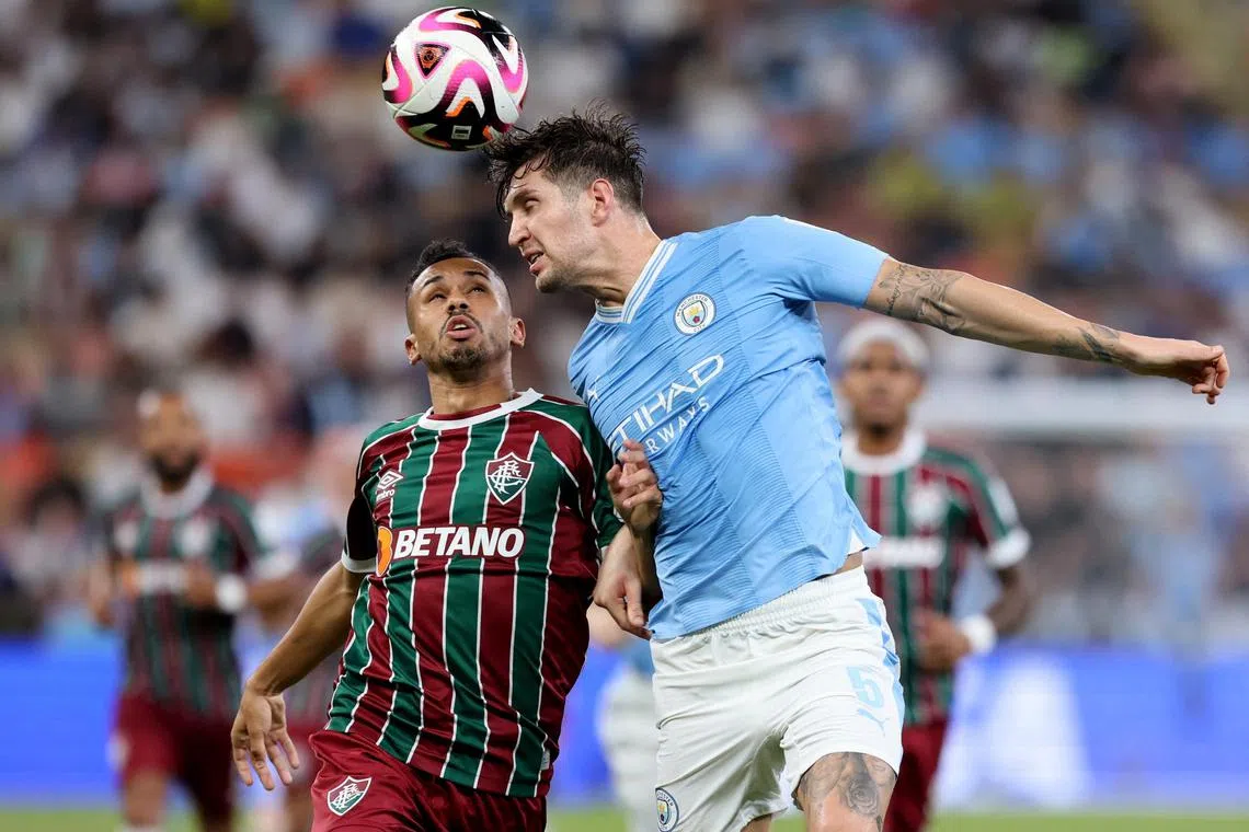 Soccer Football - Club World Cup - Final - Manchester City v Fluminense - King Abdullah Sports City, Jeddah, Saudi Arabia - December 22, 2023
Manchester City's John Stones in action with Fluminense's Lima REUTERS/Ahmed Yosri