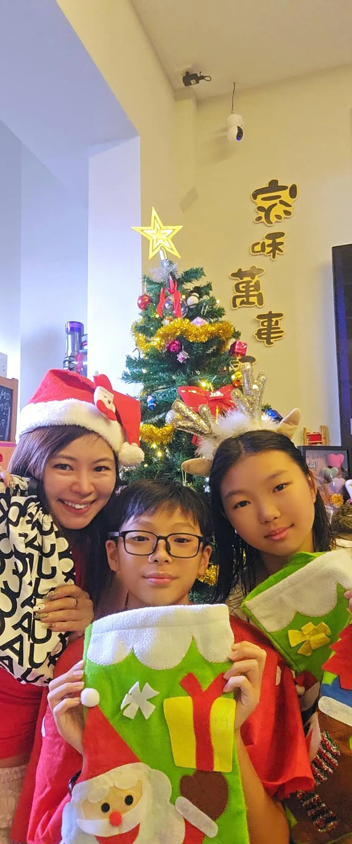 Ms Yuki Leow with her son and daughter.