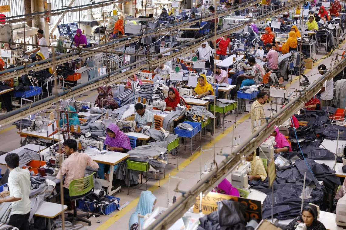 FILE PHOTO: Bangladeshi garment workers make clothing in the sewing section of a factory in Gazipur, Bangladesh, April 9, 2025. REUTERS/Mohammad Ponir Hossain/File Photo