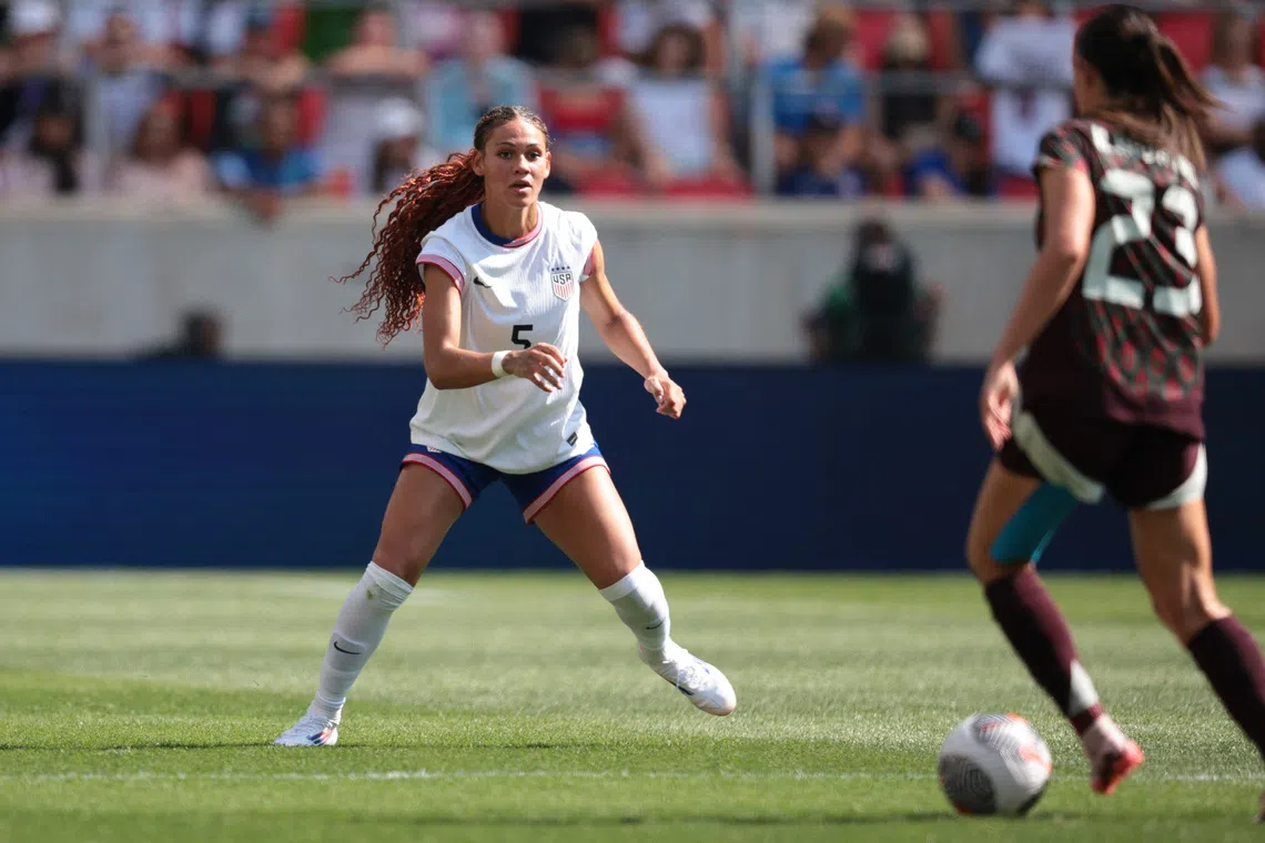 Jul 13, 2024; Harrison, New Jersey, USA; United States forward Trinity Rodman (5) in action against Mexico defender Kimberly Rodriguez (23) during the first half at Red Bull Arena. Mandatory Credit: Vincent Carchietta-USA TODAY Sports