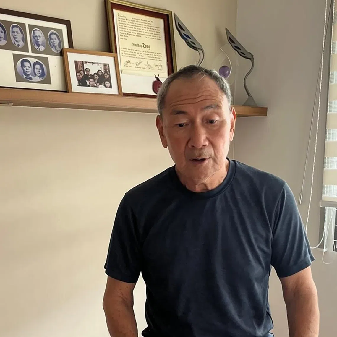 Lim Kay Tong, doing morning exercise on his stationary bicycle. 