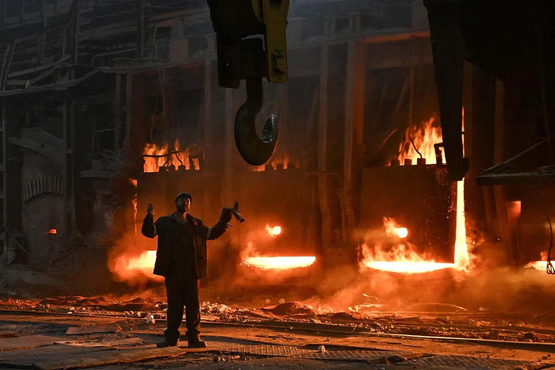An employee at a production facility of Zaporizhstal Iron and Steel Works, amid Russia's attack on Ukraine, in Zaporizhzhia, Ukraine, Nov 13, 2024. 