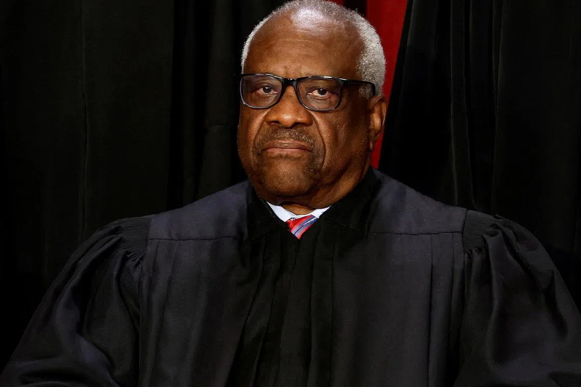 FILE PHOTO: U.S. Supreme Court Associate Justice Clarence Thomas poses during a group portrait at the Supreme Court in Washington, U.S., October 7, 2022. REUTERS/Evelyn Hockstein/File Photo