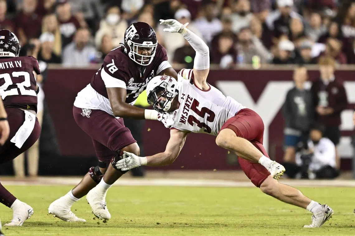 FILE PHOTO: Nov 16, 2024; College Station, Texas, USA; New Mexico State Aggies linebacker Tyler Martinez (35) defends in coverage as Texas A&M Aggies offensive lineman Dametrious Crownover (78) blocks during the second half at Kyle Field. Mandatory Credit: Maria Lysaker-Imagn Images/File Photo