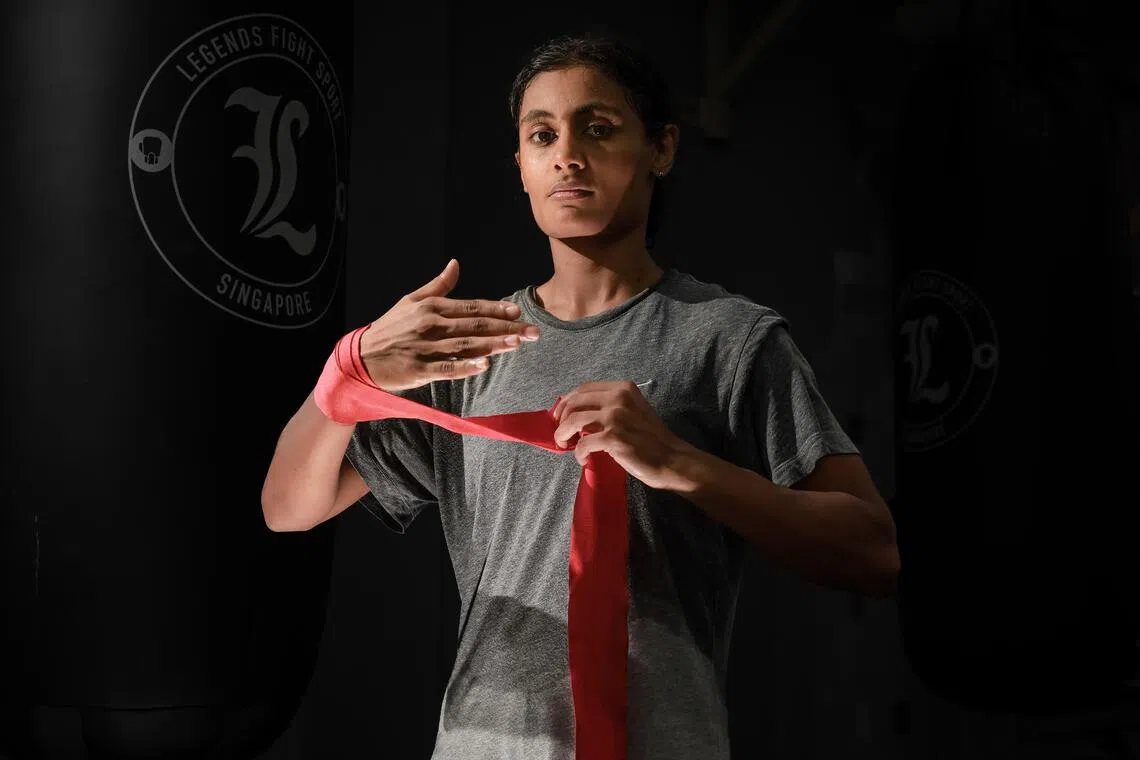 Before she puts on her boxing gloves, Danisha Mathialagan wraps her hands in metres of cloth. 