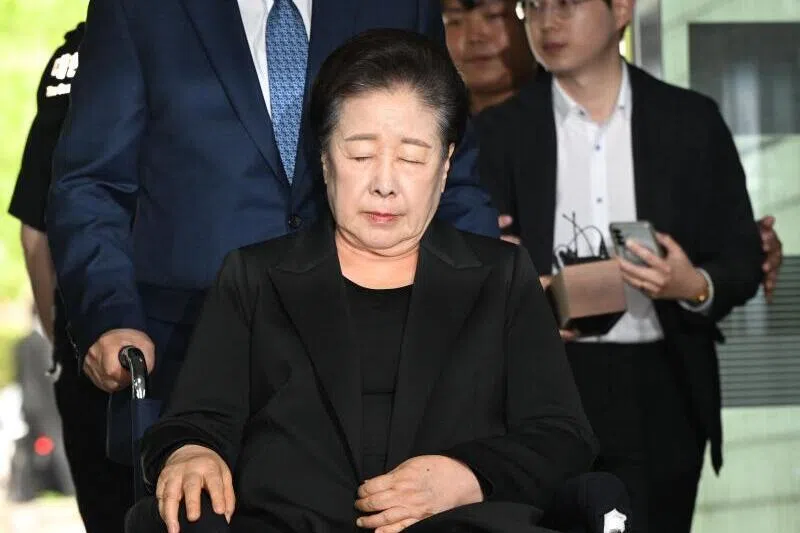 Unification Church leader Han Hak-ja arrives on a wheelchair to attend a hearing at the Seoul Central District Court in Seoul on Sept 22, 2025.