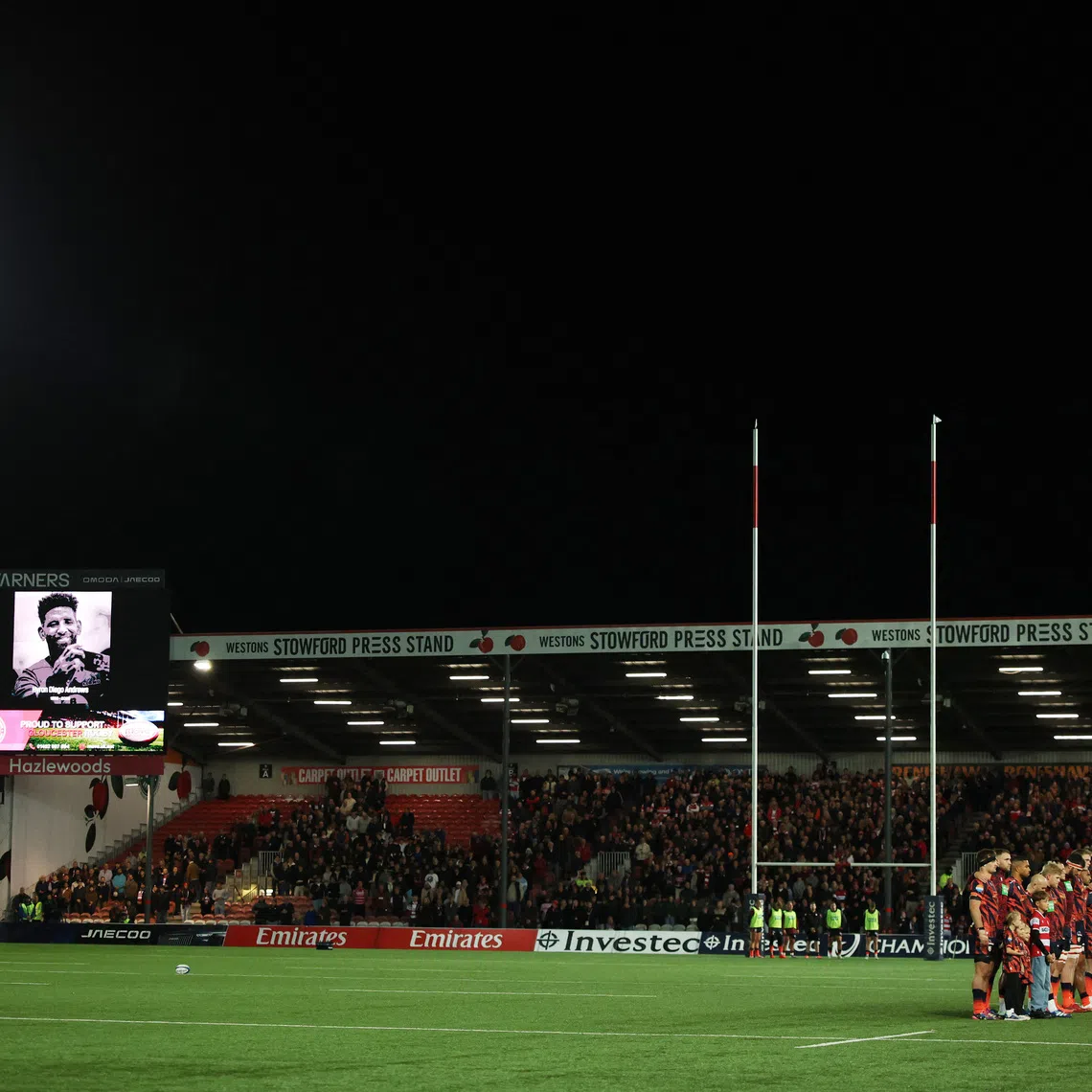 Rugby Union - European Champions Cup - Gloucester v Bordeaux Begles - Kingsholm Stadium, Gloucester, Britain - October 16, 2026 The big screen displays an image in memory of former rugby player Hyron Andrews during a minutes silence before the match Action Images via Reuters/Andrew Boyers