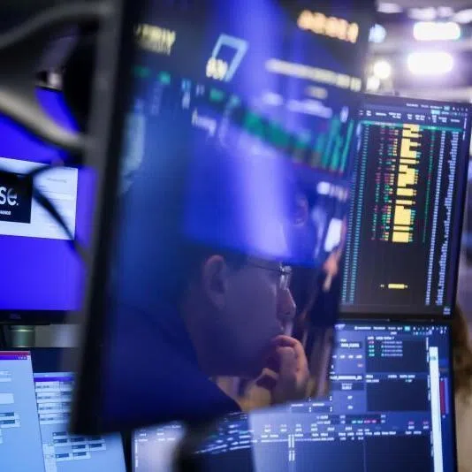 A trader works on the floor the New York Stock Exchange in New York, on Feb 2.