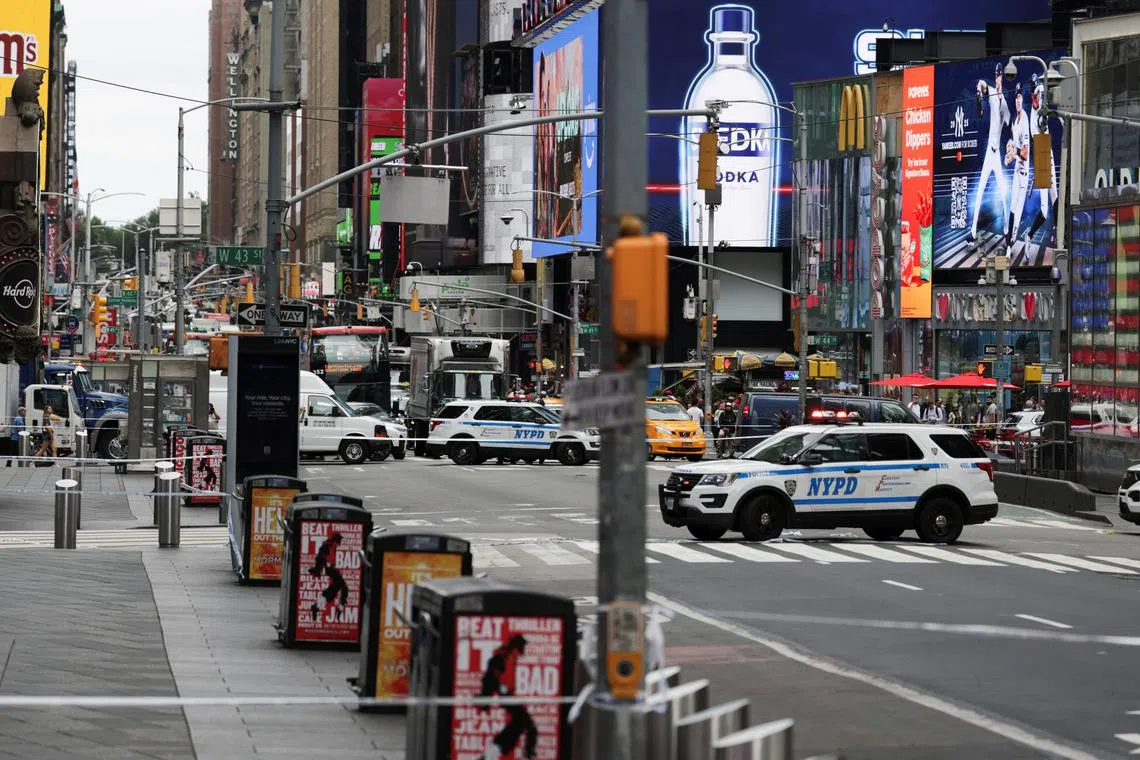 Police vehicles block a street in a cordoned off area in Times Square on Aug 18.