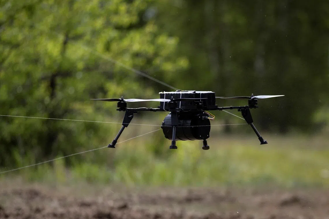 A drone that is controlled through a fiberoptic cable is snagged in its own cable during a demonstration at a defense technology event organized by the defence accelerator Defence Builder, amid Russia's attack on Ukraine, in an unspecified location in Ukraine, May 30, 2026. REUTERS/Thomas Peter