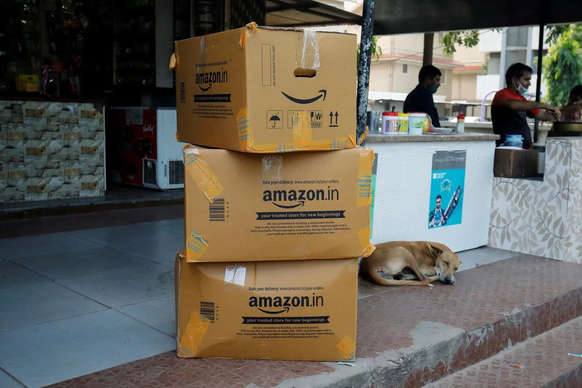 FILE PHOTO: Amazon delivery packages are seen outside a shop in Ahmedabad, India, October 5, 2021. REUTERS/Amit Dave/File Photo