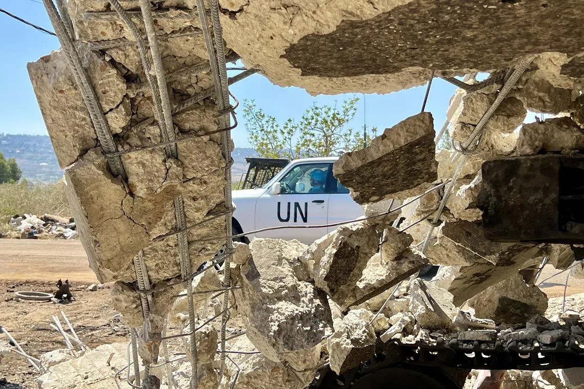 A vehicle of UN peacekeeping force next to the site of an Israeli airstrike on Deir Seryan Town in the Marjayoun District, in Lebanon, on Aug 7.