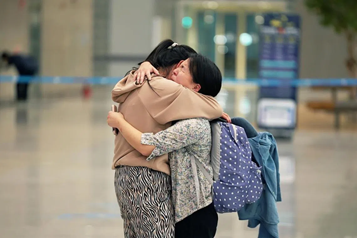 Ms Jee Won Ha (left) and Ms Darragh Hannan (right) at Incheon Airport, meeting each other for the first time after being separated soon after birth.