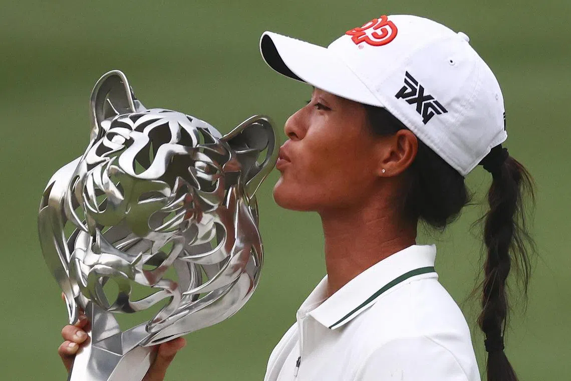 Celine Boutier of France kissing the trophy after winning the final round of the LPGA Maybank Championship 2023 in Kuala Lumpur, Malaysia, on Sunday.