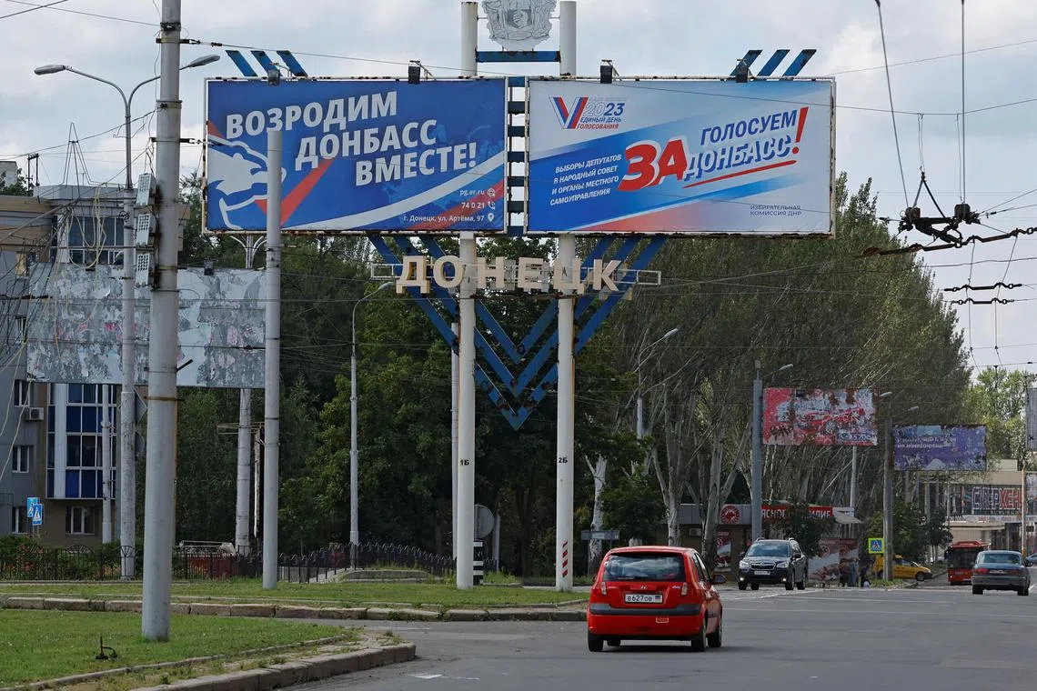 The banners read "Let's revive Donbas together!" and "Vote for Donbas!". They were put up ahead of regional elections planned by the Russian-installed authorities in Donetsk, Russian-controlled Ukraine. 