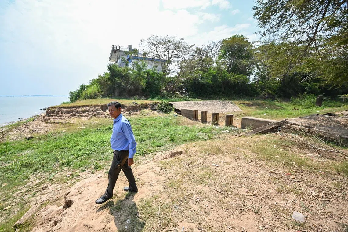 ST20240221-202447705151-Lim Yaohui-Tan Hui Yee-hymekong/
(PLEASE DO NOT USE THIS PICTURE. IT IS FOR HUI YEE'S STORY IN LATE APRIL, 2024)
Mr Chey Saman, 70, chief of Somrong Thom commune, walking on the dry canal next to the Mekong River (left) at Prek Takeo in Kandal Province, Cambodia on Feb 27, 2024.
Funan Techo Canal project stretches 180 km from the Mekong River’s Prek Takeo, via the Bassac River’s Prek Ta Ek, and ends at Prek Ta Hing.
Many doomsday stories exist about the Mekong River. This package aims to take a more holistic view by showcasing the people and communities fighting to save it.
The longstanding issues – damming of the river, blocked passage of fish, land erosion because there is not enough sediment and nutrients flowing downstream – need to be understood in the context of the global and regional shift towards renewable energy and “clean” energy.
Singapore electricity companies are importing and/or have plans to import hydropower from Laos and Cambodia. Singapore’s net zero ambition is inextricably linked to the Mekong River and its tributaries. But this is not an either-or debate.
The story will talk about all the competing needs for the Mekong River and discuss ways in which local communities have tried to imagine a new and better future for the waterway.
Already, we are seeing some successes: Discovery of the world’s largest freshwater stingray in the Mekong, the birth of new Irrawaddy dolphins in the parts of the Mekong tributaries under Cambodian stewardship.
ST PHOTO: LIM YAOHUI)