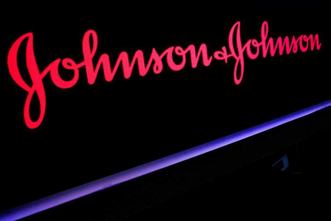 FILE PHOTO: The Johnson & Johnson logo is displayed on a screen on the floor of the New York Stock Exchange (NYSE) in New York, U.S., May 29, 2019. REUTERS/Brendan McDermid/File Photo