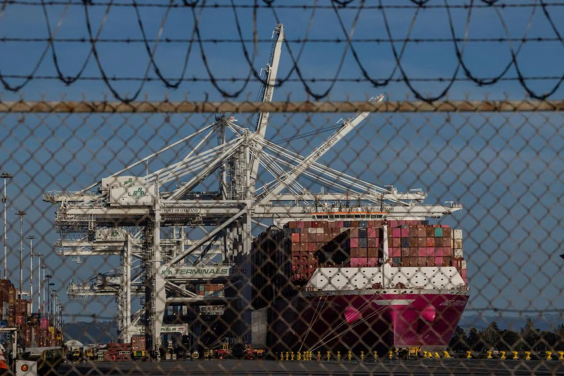 A cargo ship full of shipping containers is seen at the port of Oakland, as trade tensions escalate over U.S. tariffs with China, in Oakland, California, U.S., April 10, 2025. REUTERS/Carlos Barria