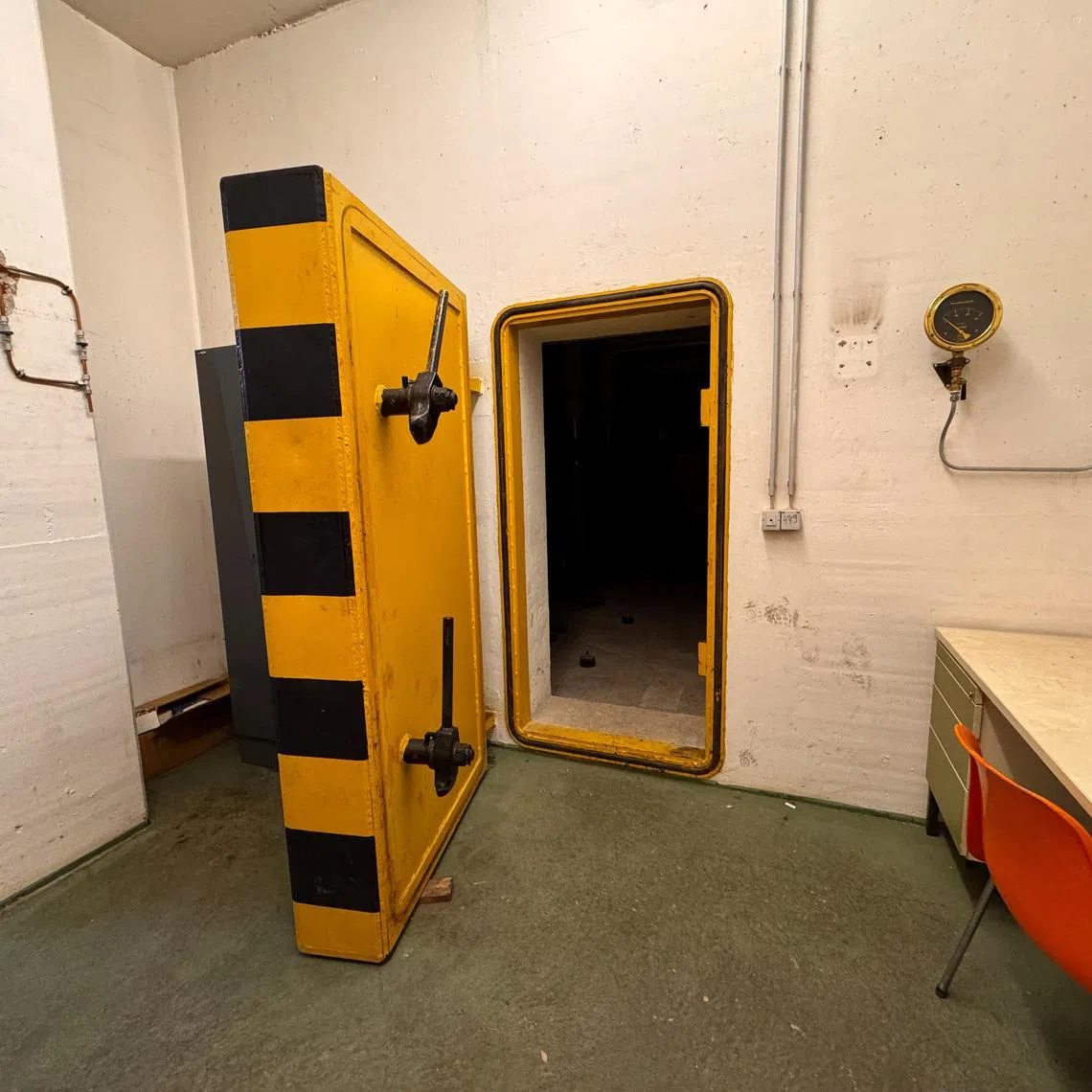 A yellow marked door is pictured in a civil defence shelter in Munich, Germany, December 6, 2024.     REUTERS/Christine Uyanik
