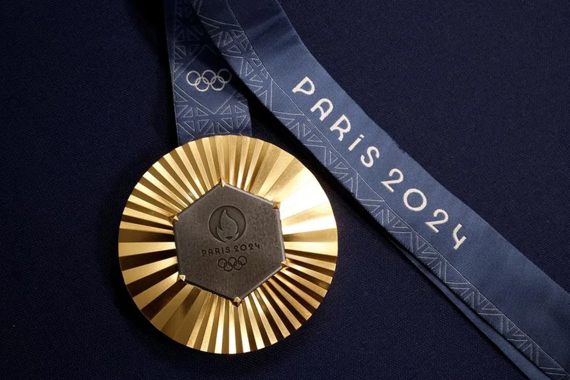 FILE PHOTO: Paris 2024 Olympics Medal Preview - Chaumet, Paris, France - February 1, 2024 A Paris 2024 Olympic Games gold medal is seen on display at Chaumet jewellery REUTERS/Benoit Tessier/File Photo